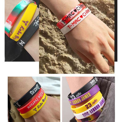 Muchos colores de brillo nocturno luminoso pulseras de silicona para el baloncesto Juegos de fútbol Star Ball