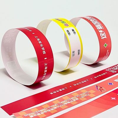 Papel sintético de PP con pulsera personalizada para eventos Logotipo del parque de fiestas Impreso Impermeable a la sudoración Resistente a la entrada Pulseras de entrada