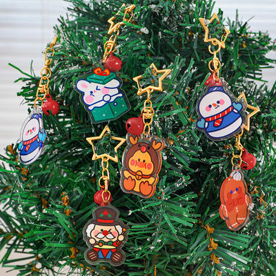 Fiesta de Navidad personalizada Cerro llavero acrílico anillo de metal transparente lindo dibujo animado de Navidad muñeco de nieve impreso Cerro llavero encantador